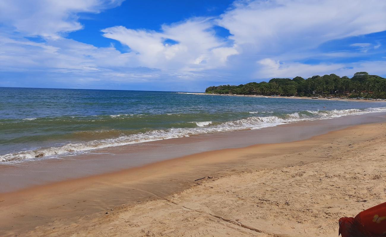 Фото Pottuvil Beach с светлый песок поверхностью