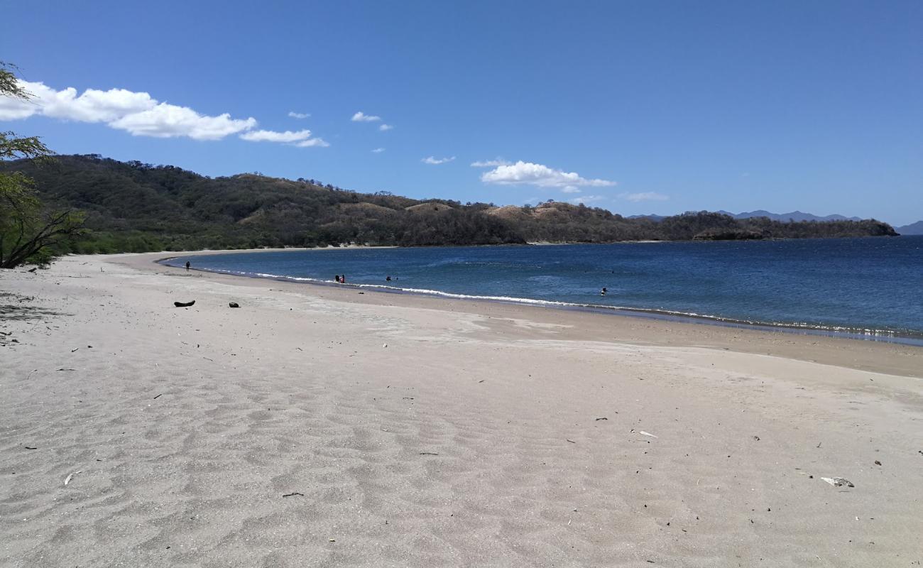 Фото Junquillal beach с светлый песок поверхностью