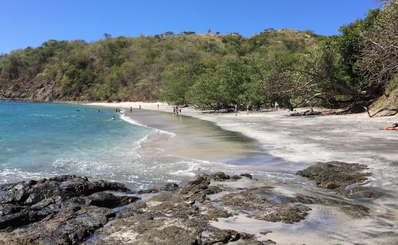 Фото Dantita Beach с золотистый песок поверхностью