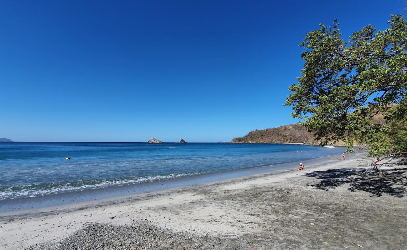 Фото Danta Beach с серый песок поверхностью