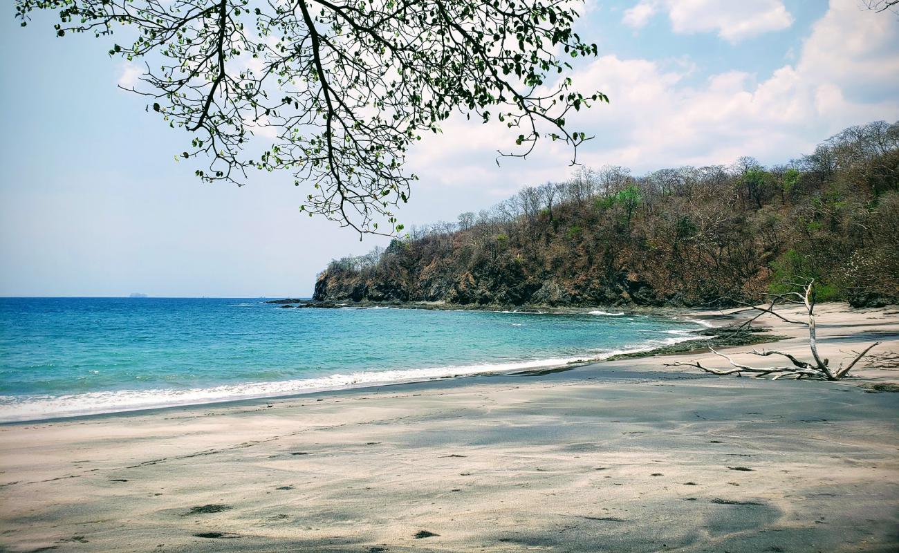 Фото Playa Conejera с светлый песок поверхностью