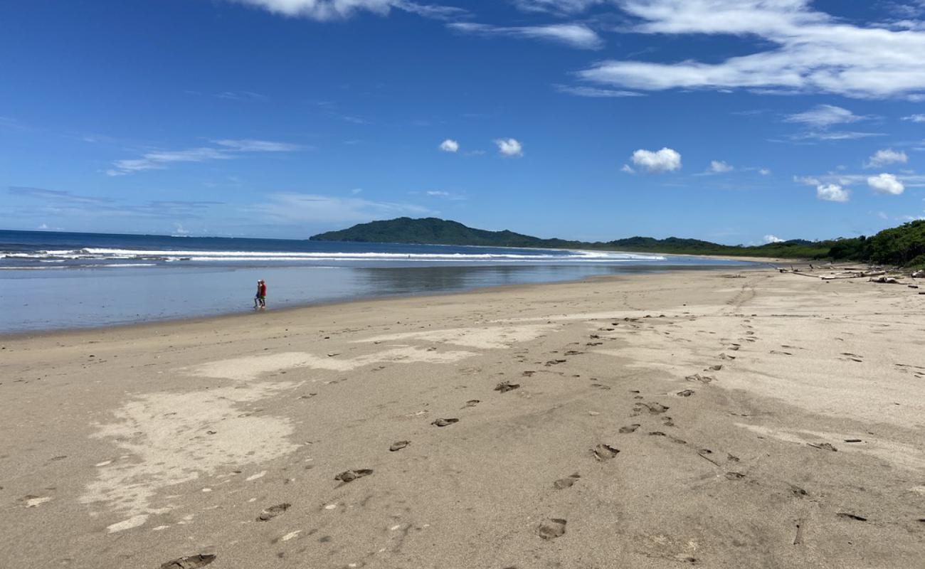 Фото Playa Grande с светлый песок поверхностью