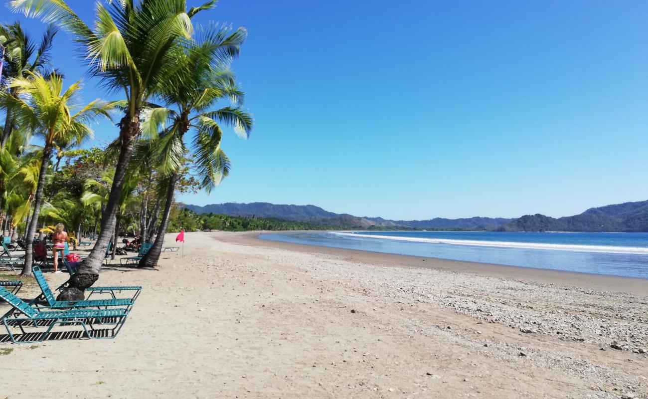 Фото Tambor Beach с песок с галькой поверхностью