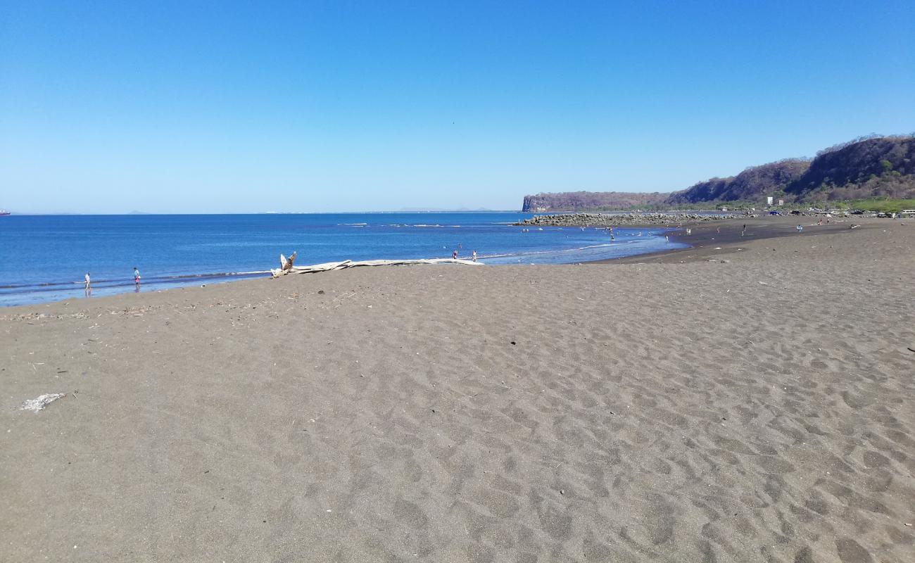 Фото Playa Caldera Bulevar с серый песок поверхностью