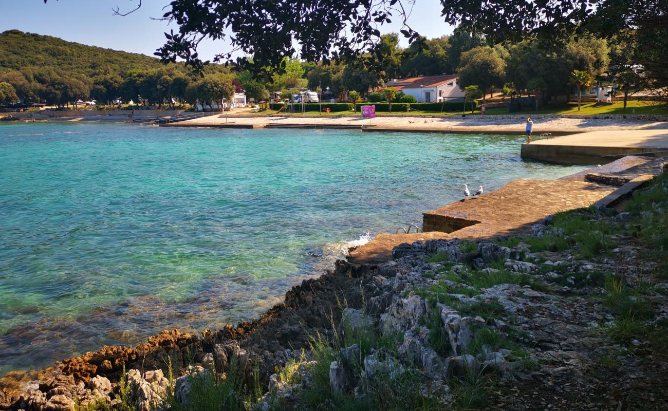 Фото Porto Sole beach с бетон поверхностью