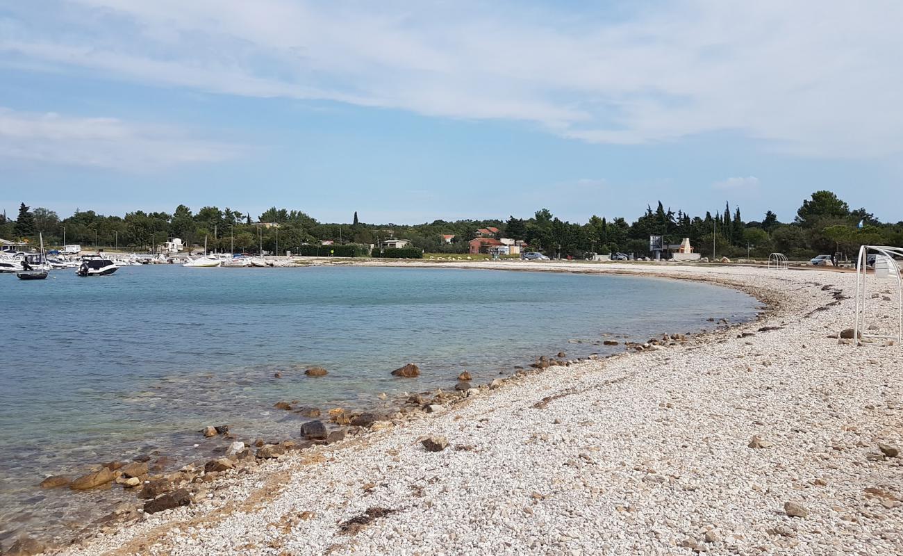 Фото Portic beach с камни поверхностью