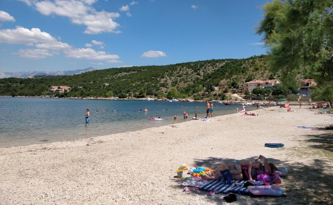 Фото Dumicina beach с белая чистая галька поверхностью