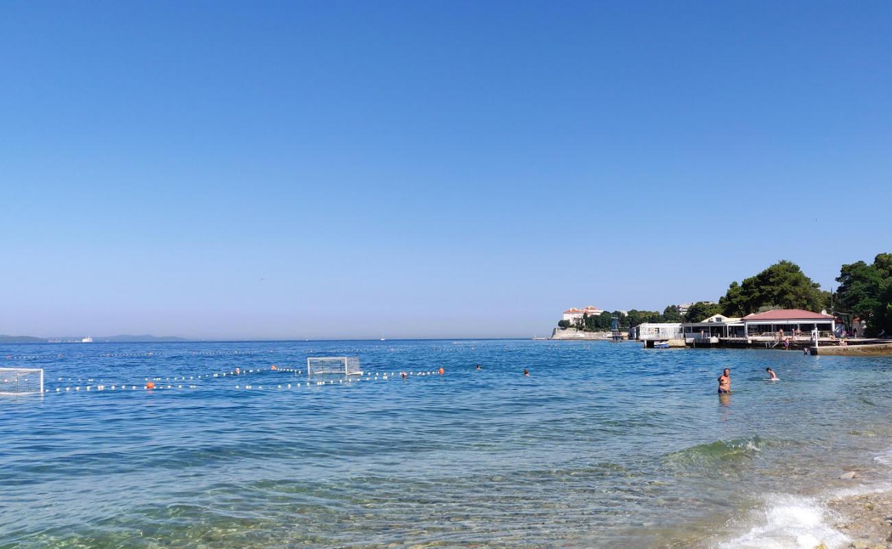 Фото Kolovare beach с светлая галька поверхностью