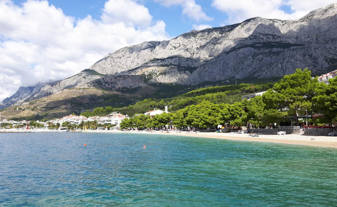 Фото Kraj beach с белая чистая галька поверхностью