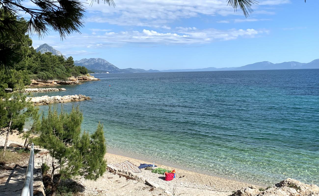 Фото Male Ciste beach с белая чистая галька поверхностью