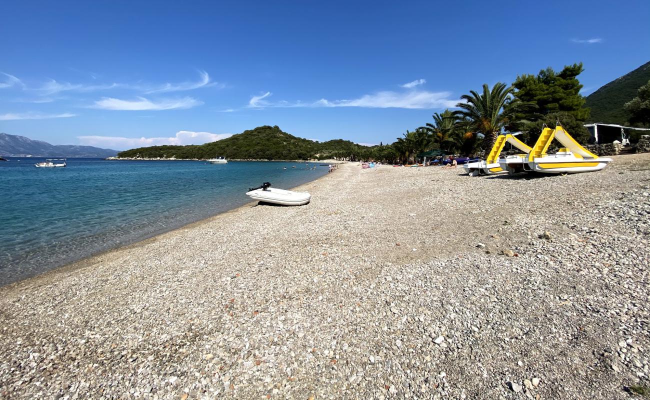 Фото Pozora II beach с темная чистая галька поверхностью