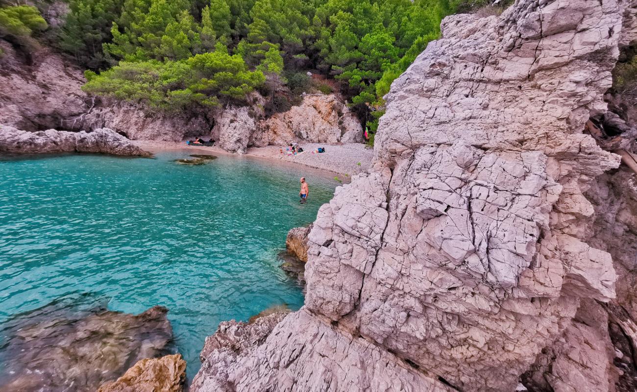 Фото Drance beach с светлая галька поверхностью