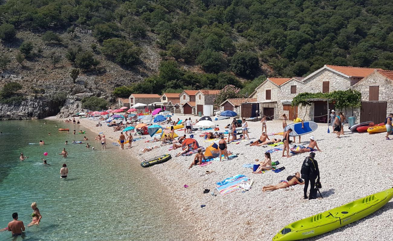 Фото Beli beach с светлая галька поверхностью