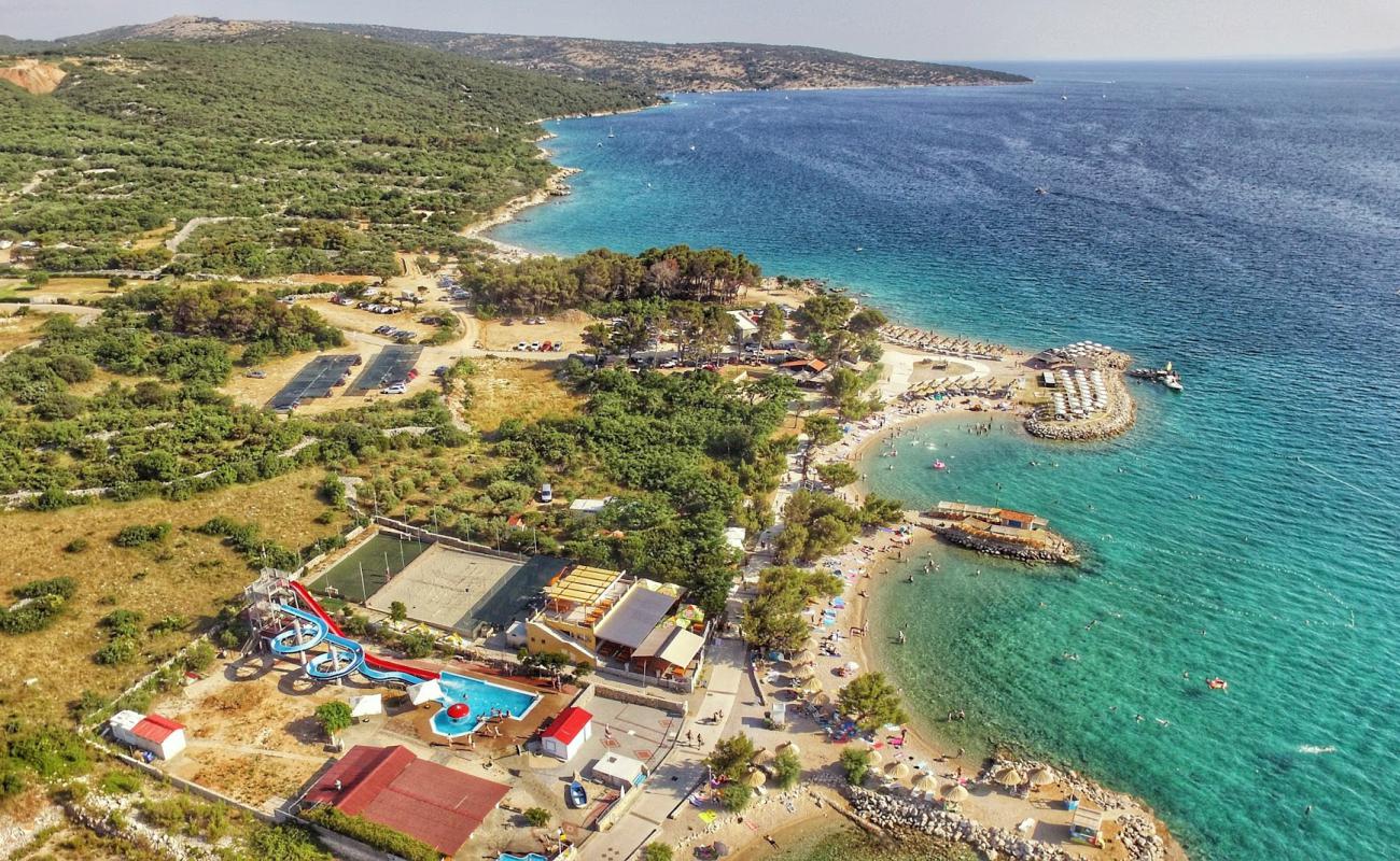 Фото Punta Debi beach с белая чистая галька поверхностью