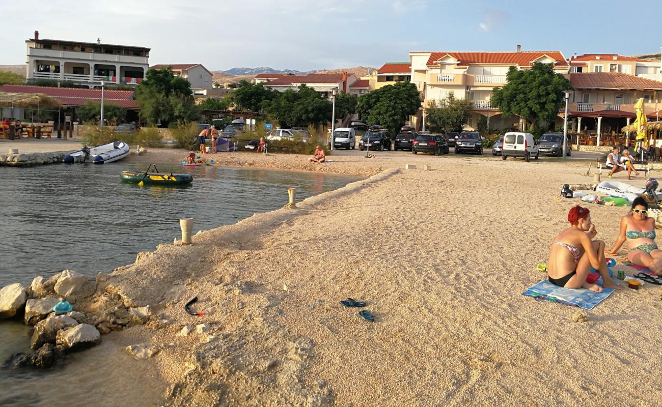 Фото Kustici beach с белая чистая галька поверхностью