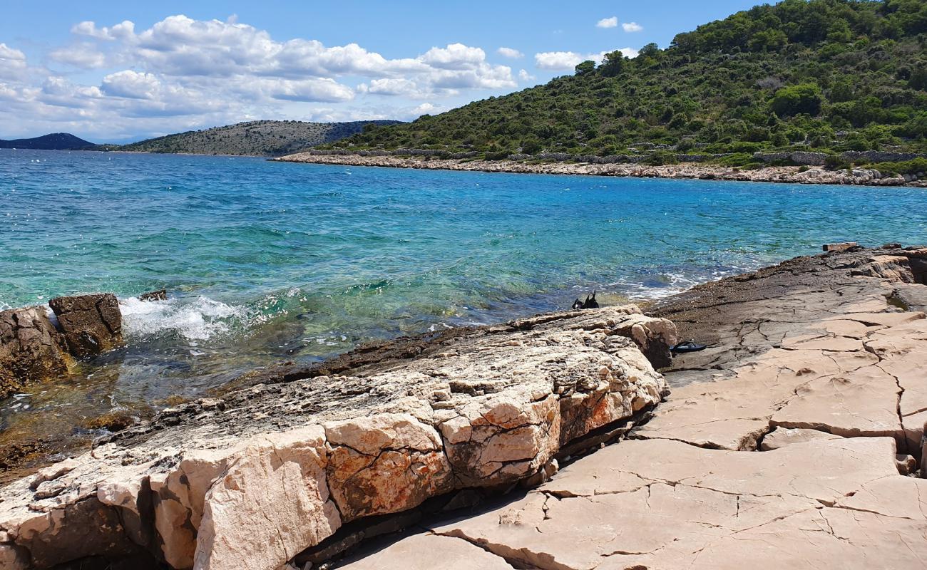 Фото Portic beach с камни поверхностью