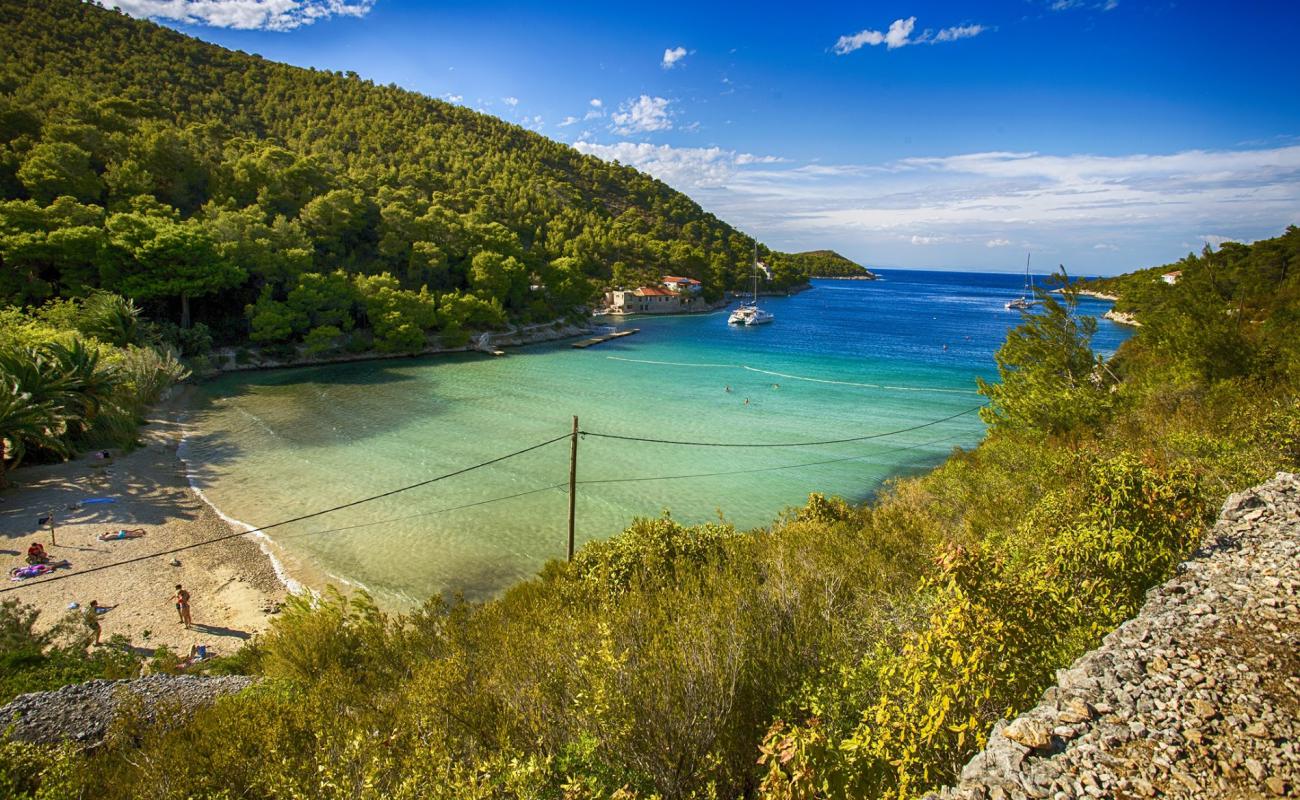 Фото Stoncica beach с светлый песок поверхностью