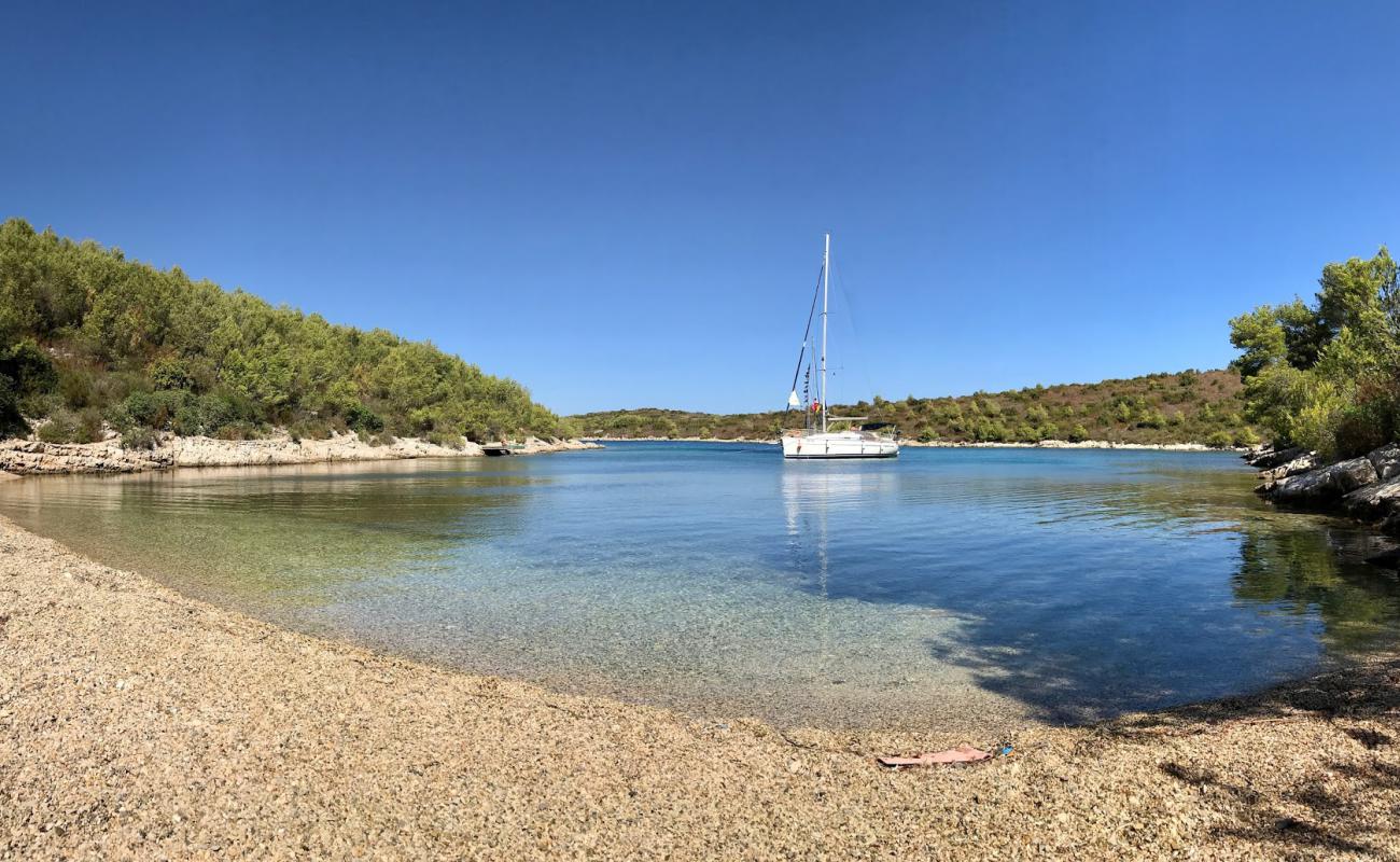 Фото Dijana beach с серая чистая галька поверхностью