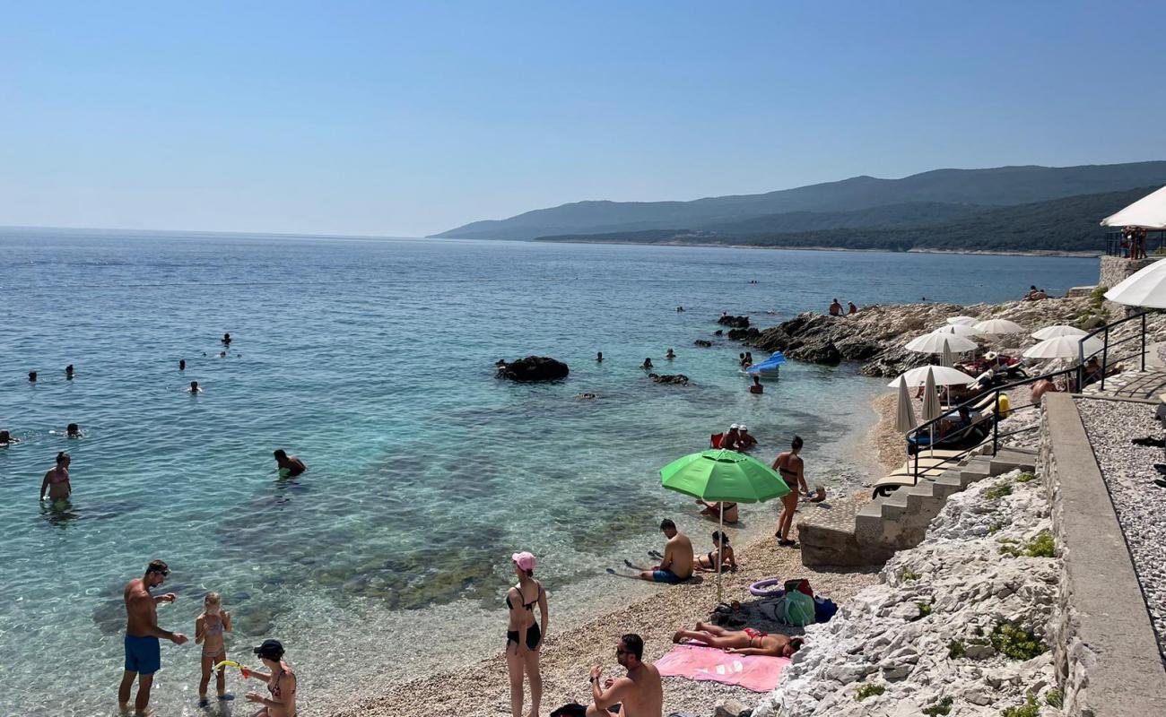 Фото Lanterna Beach с светлая галька поверхностью