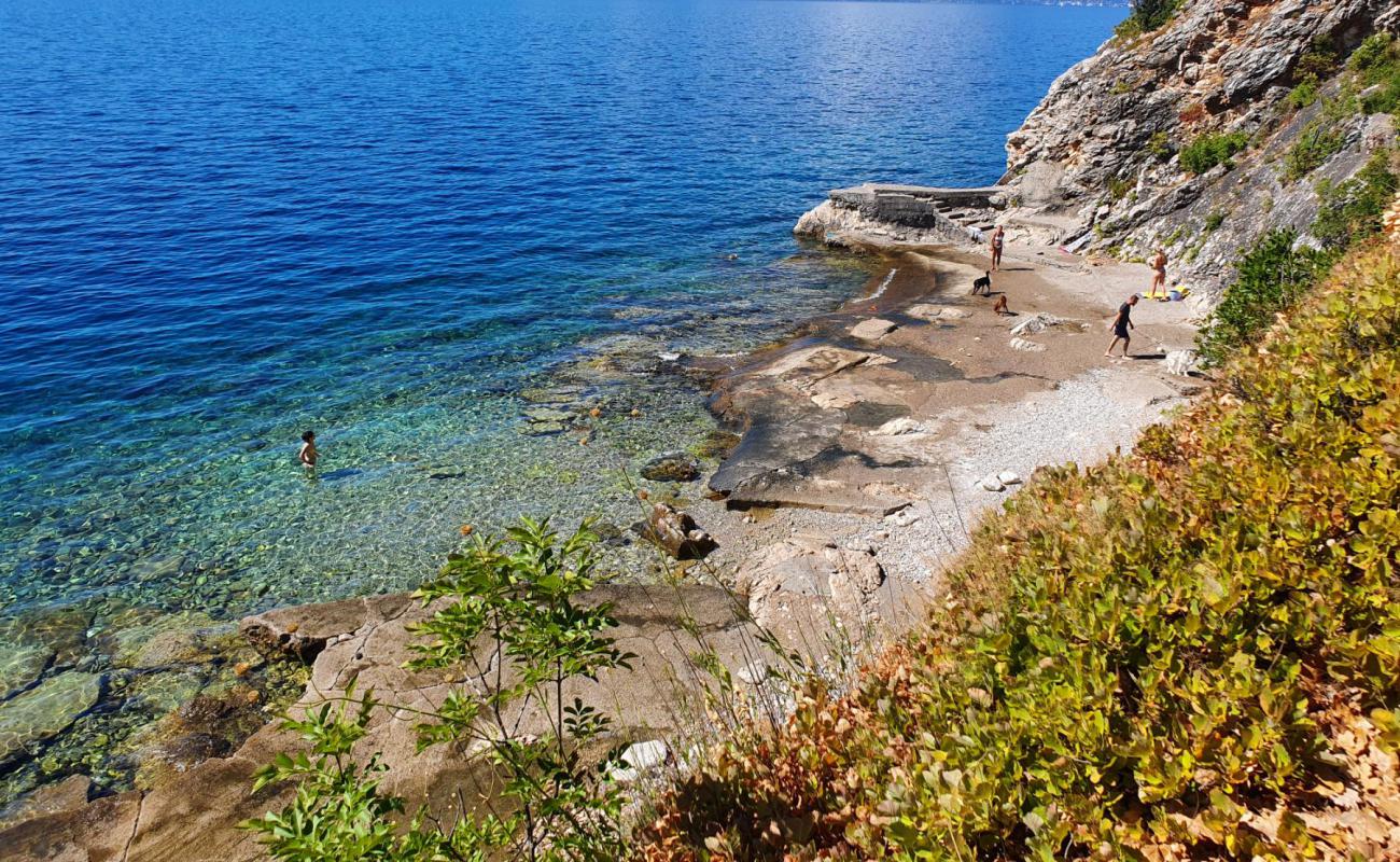 Фото Doricici Dog Beach с камни поверхностью