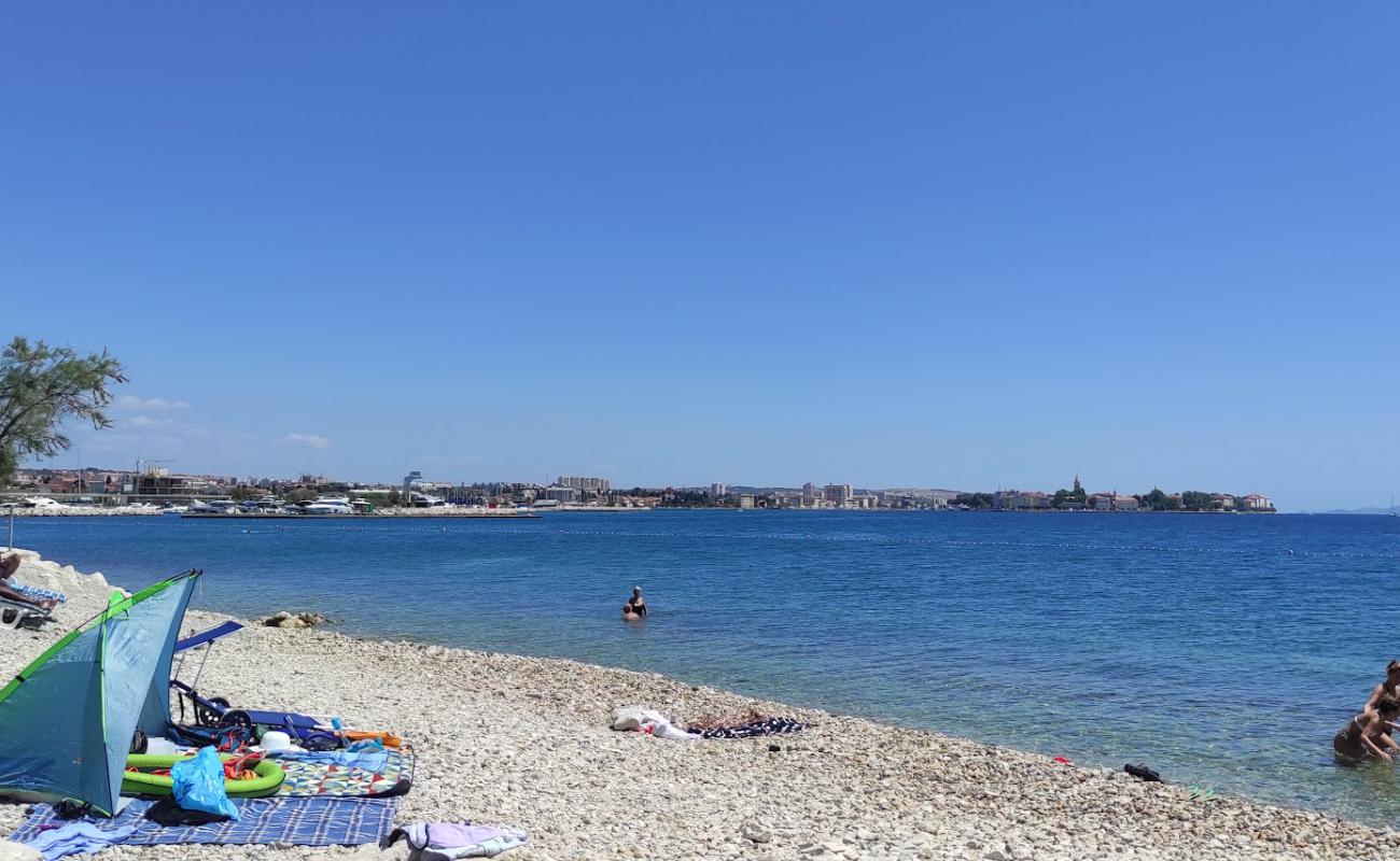 Фото Puntamika Beach с серая галька поверхностью