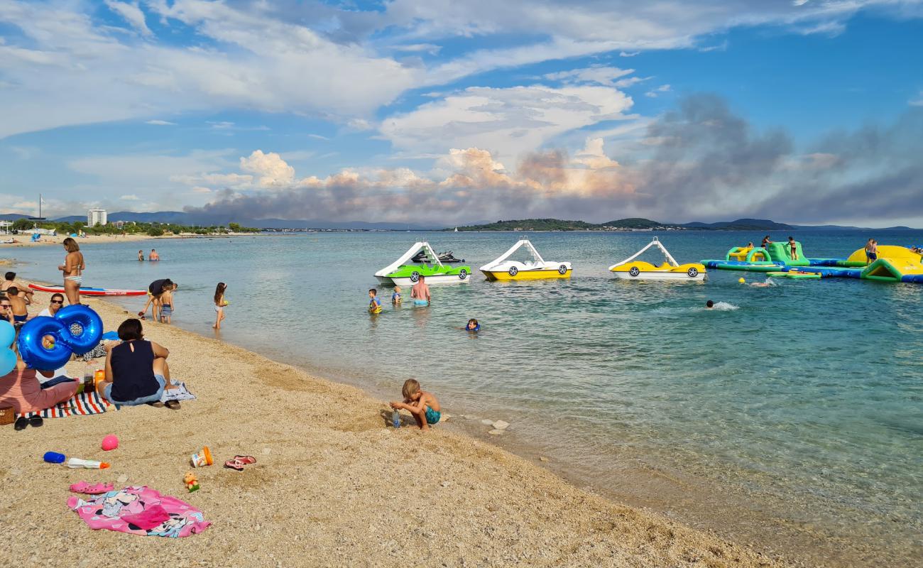 Фото Tribunj Beach с камни поверхностью