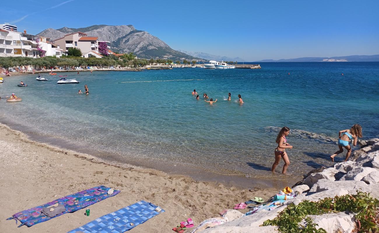 Фото Beach Duce с светлый песок поверхностью