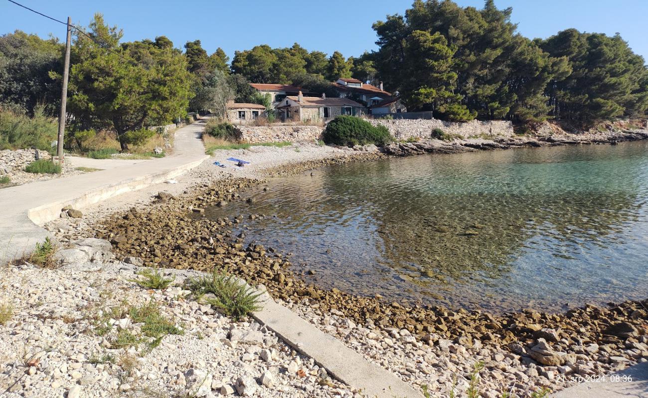 Фото Dolinje Beach с камни поверхностью