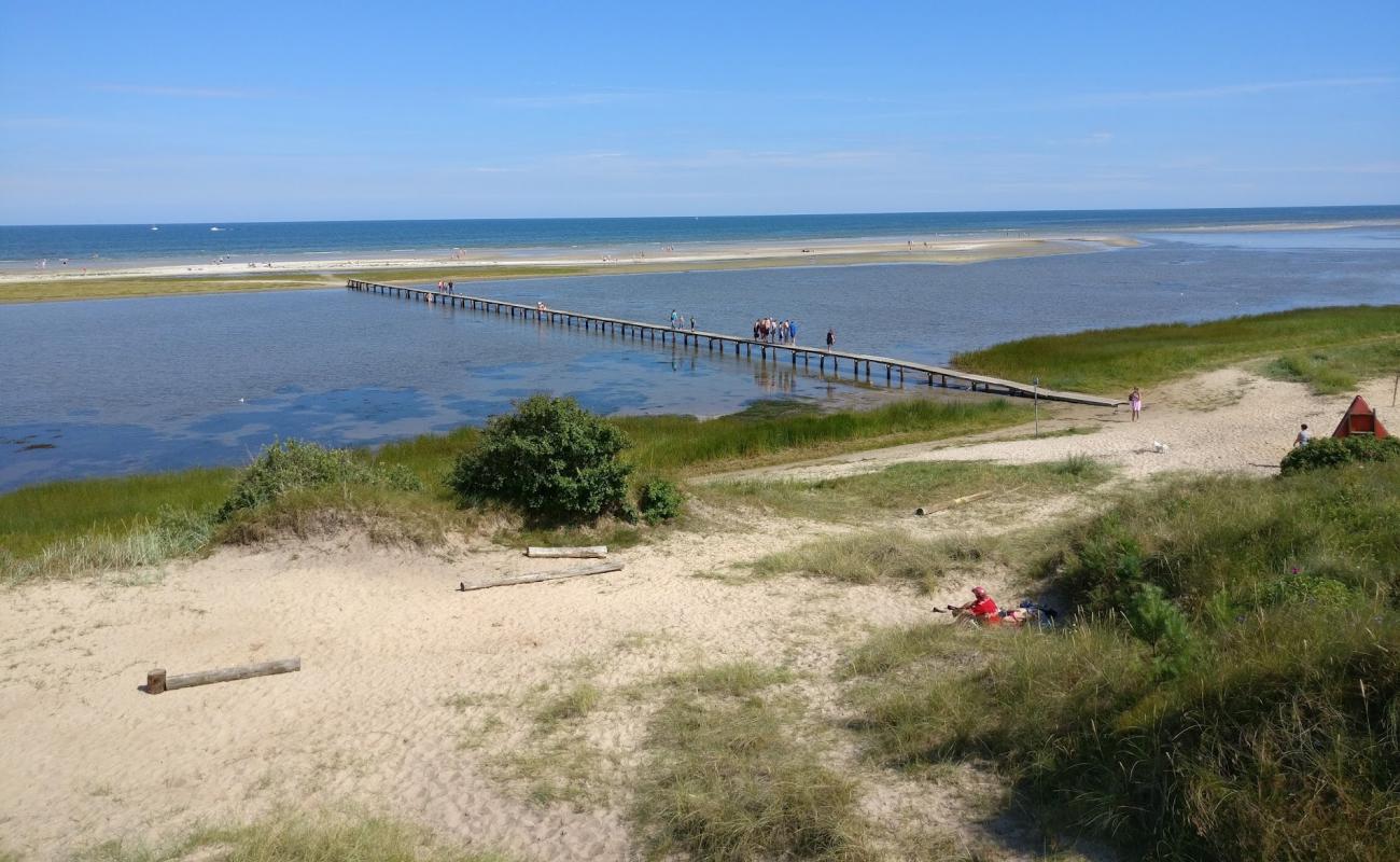 Фото Oster Hurup Beach с светлый песок поверхностью