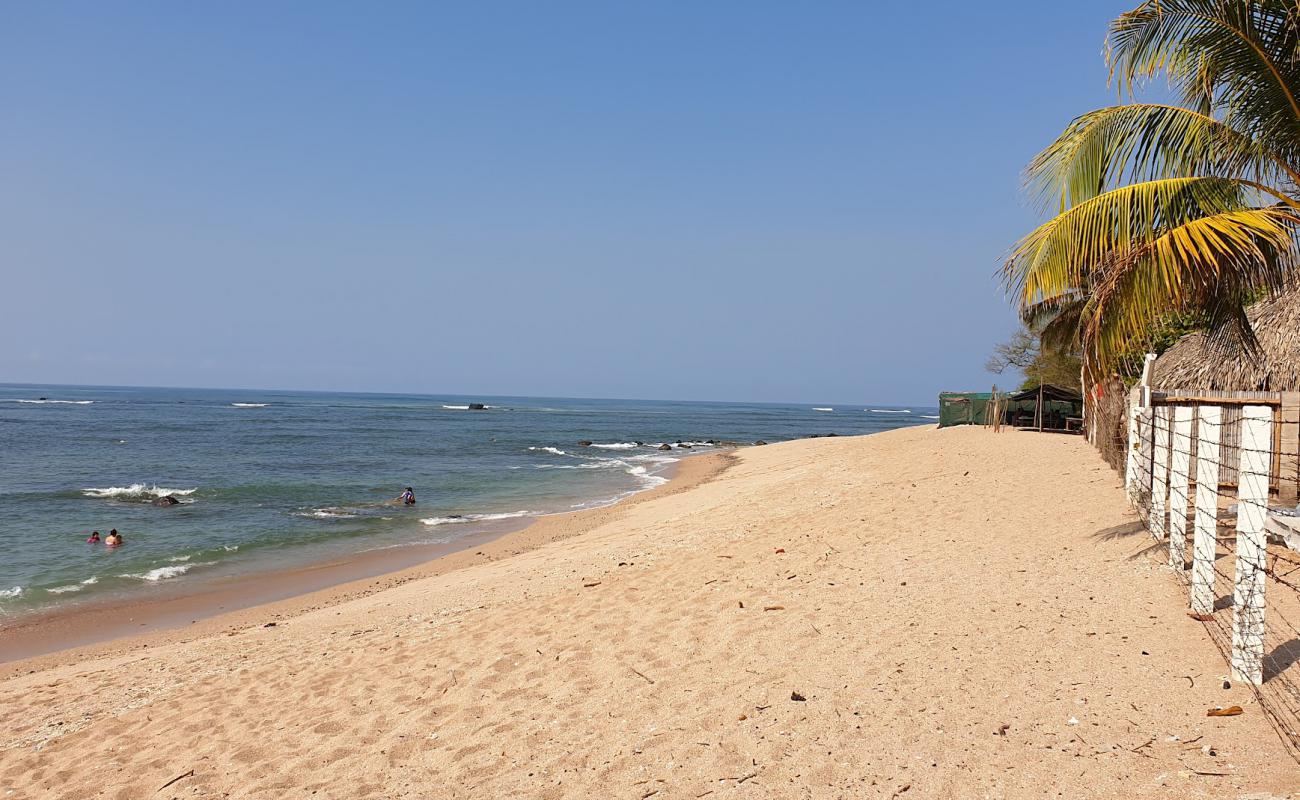 Фото Cobanos beach с песок с камнями поверхностью