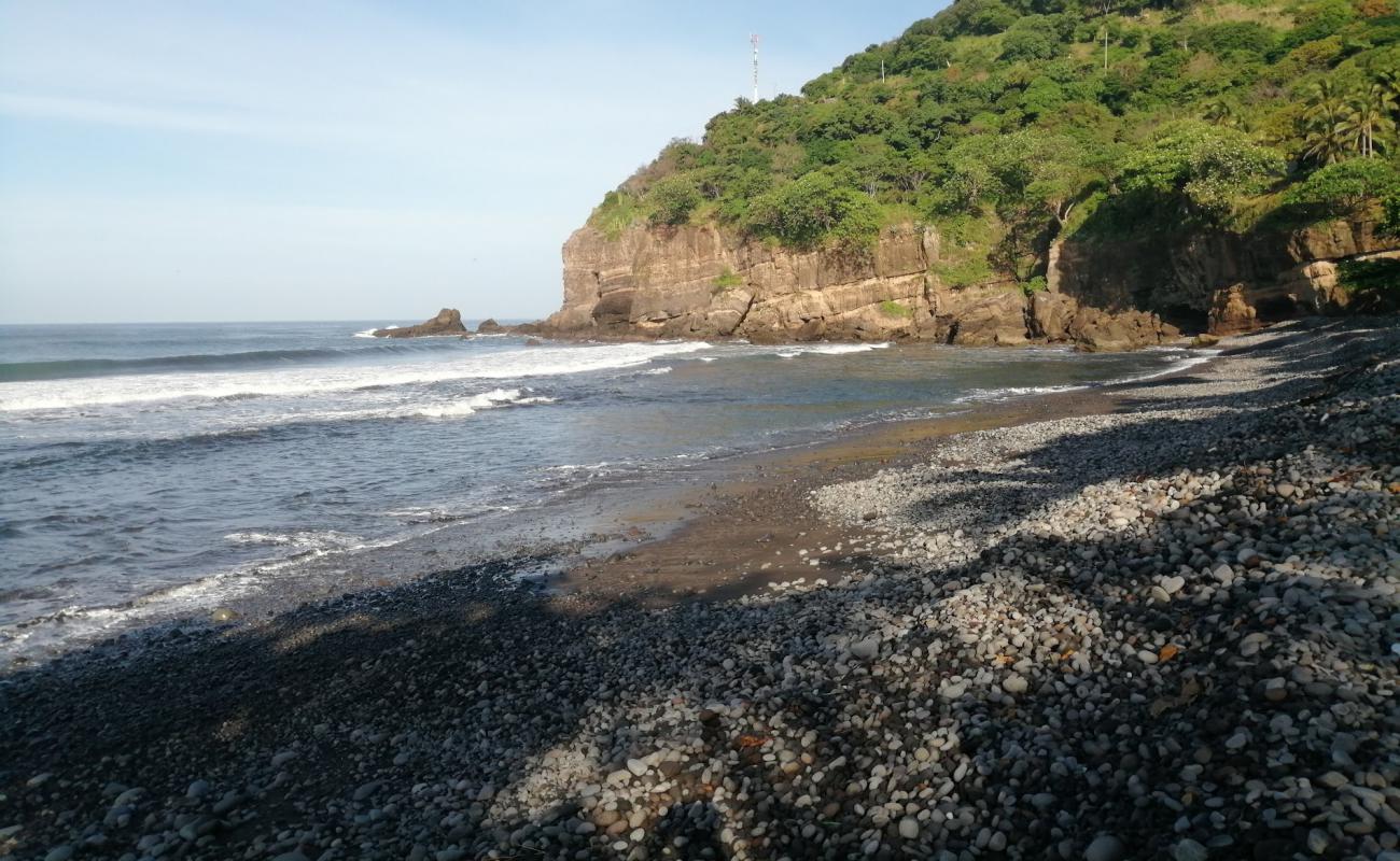 Фото La Perla beach с серая галька поверхностью