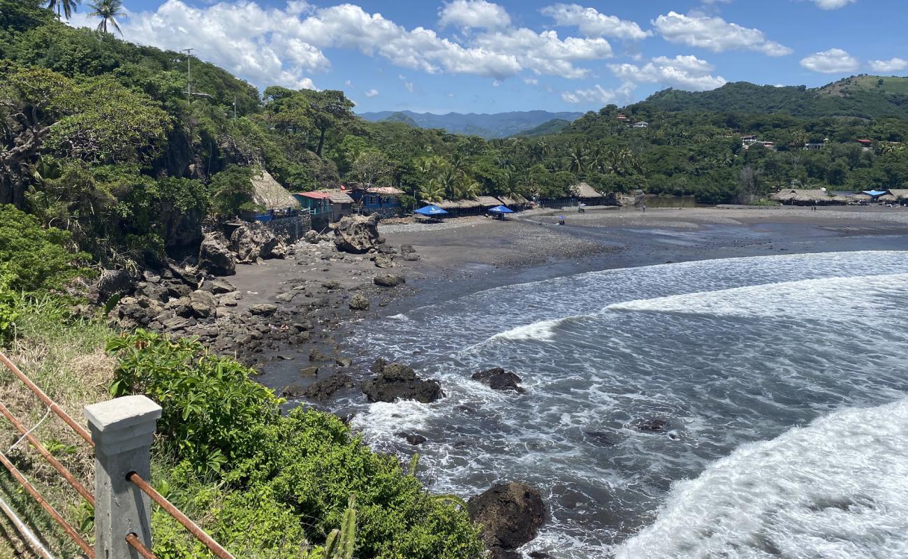 Фото El Palmarcito Beach с песок с галькой поверхностью