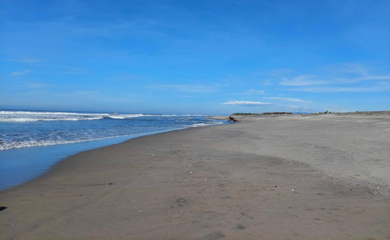 Фото San Marcelino beach с серый песок поверхностью