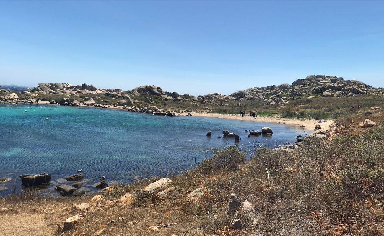 Фото Cala Sderenaia с кристальная вода поверхностью