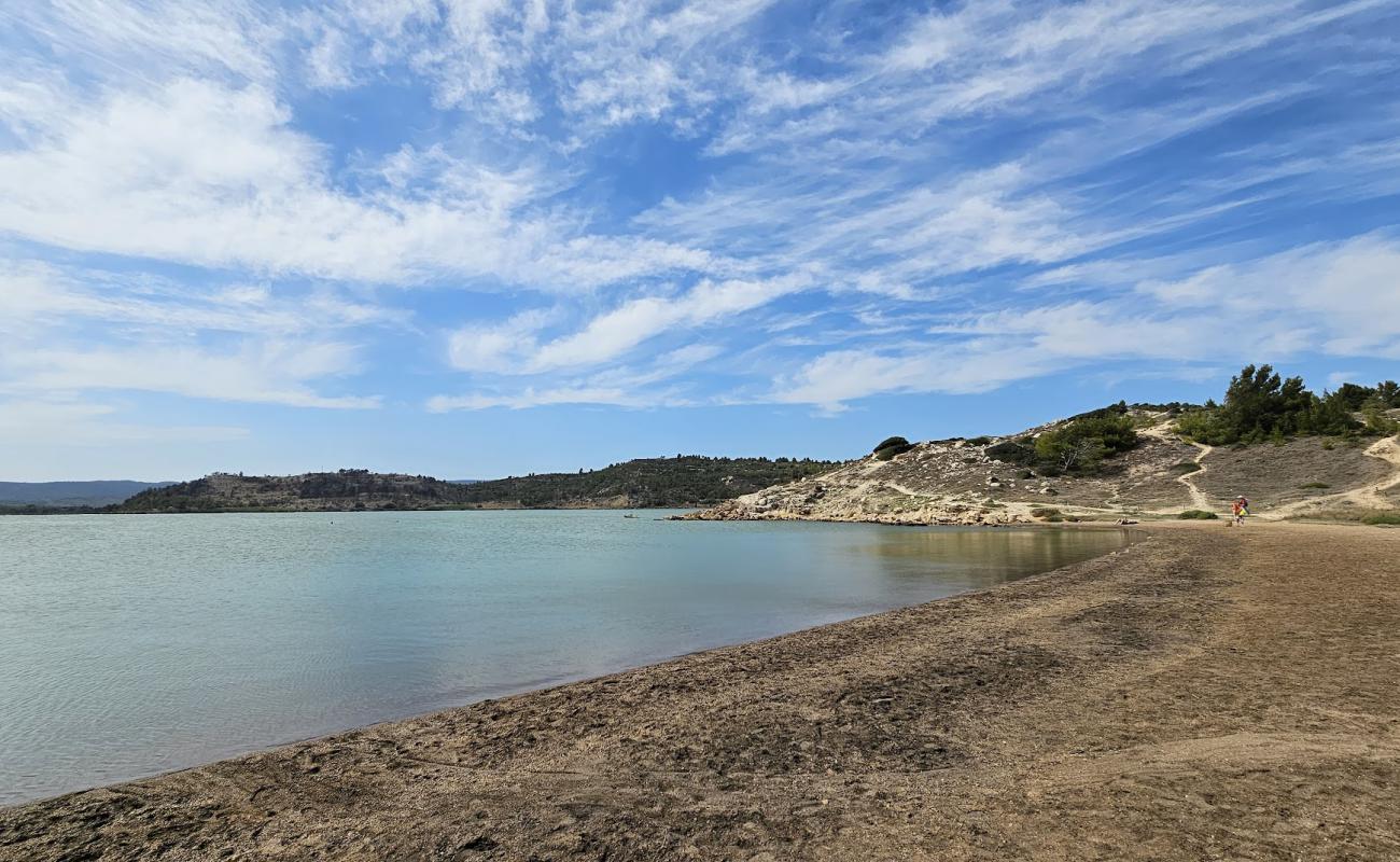 Фото Plage du Doul с песок с камнями поверхностью