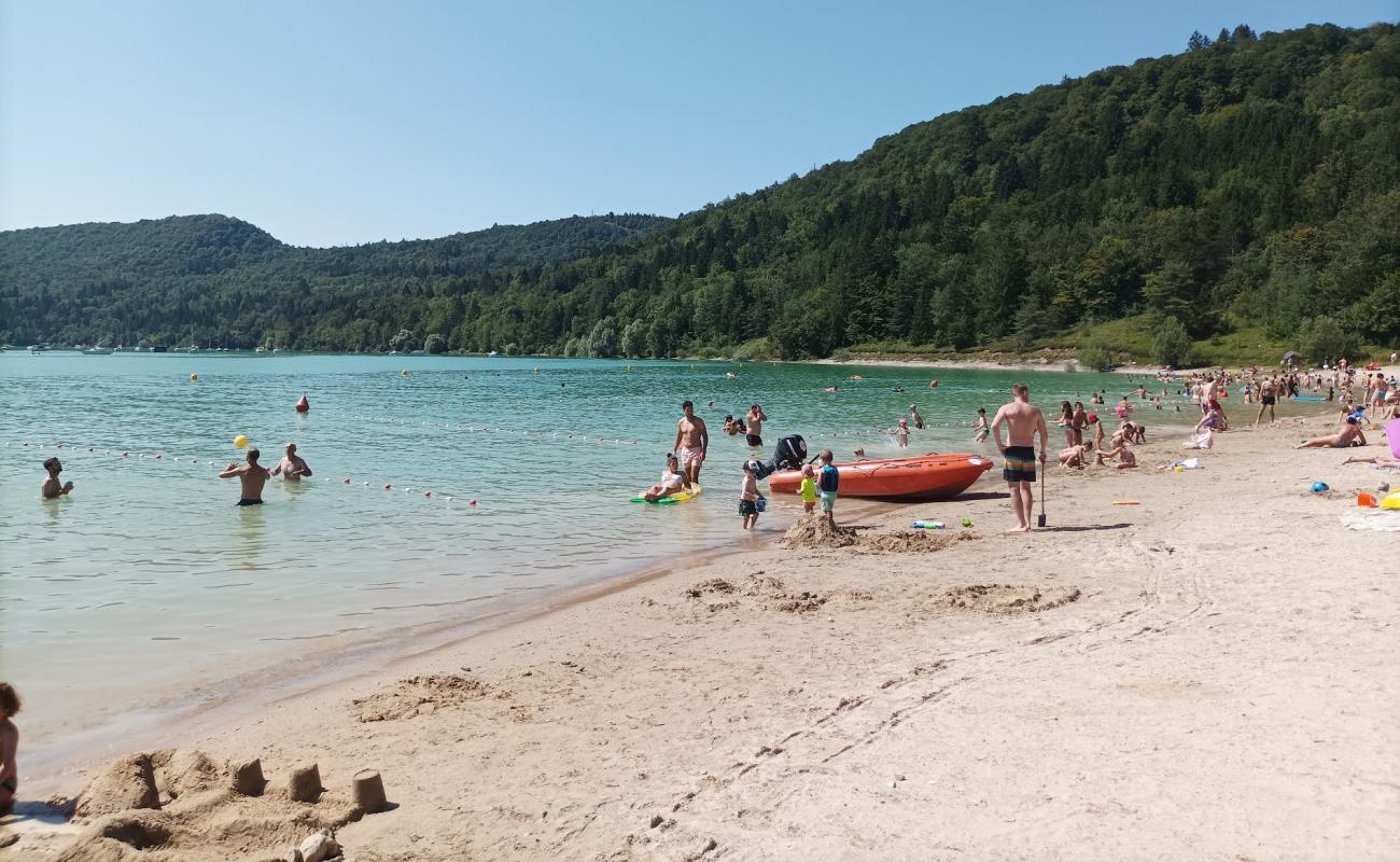 Фото Plage de Bellecin с песок с камнями поверхностью