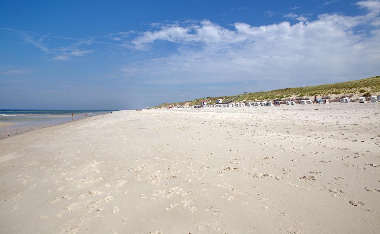 Фото Weststrand с светлый песок поверхностью