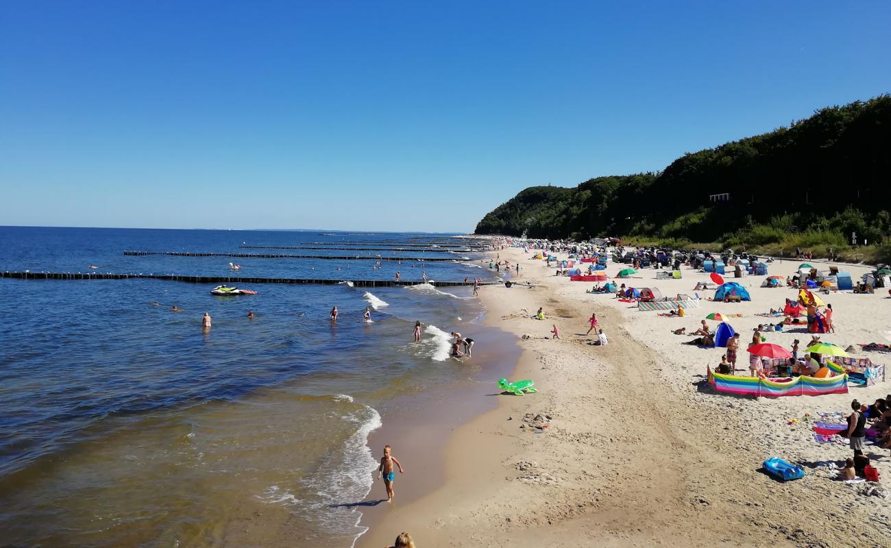 Фото Strand Koserow с светлый песок поверхностью