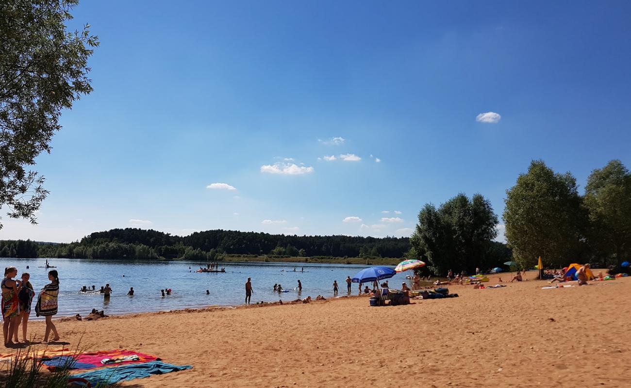 Фото Strandbad Enderndorf с светлый песок поверхностью