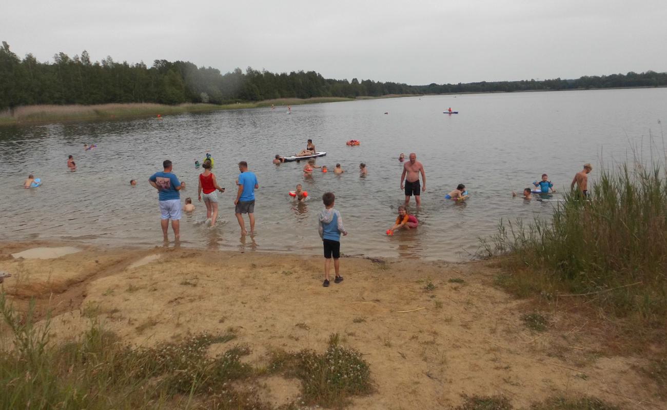 Фото Harthsee Beach с светлый песок поверхностью