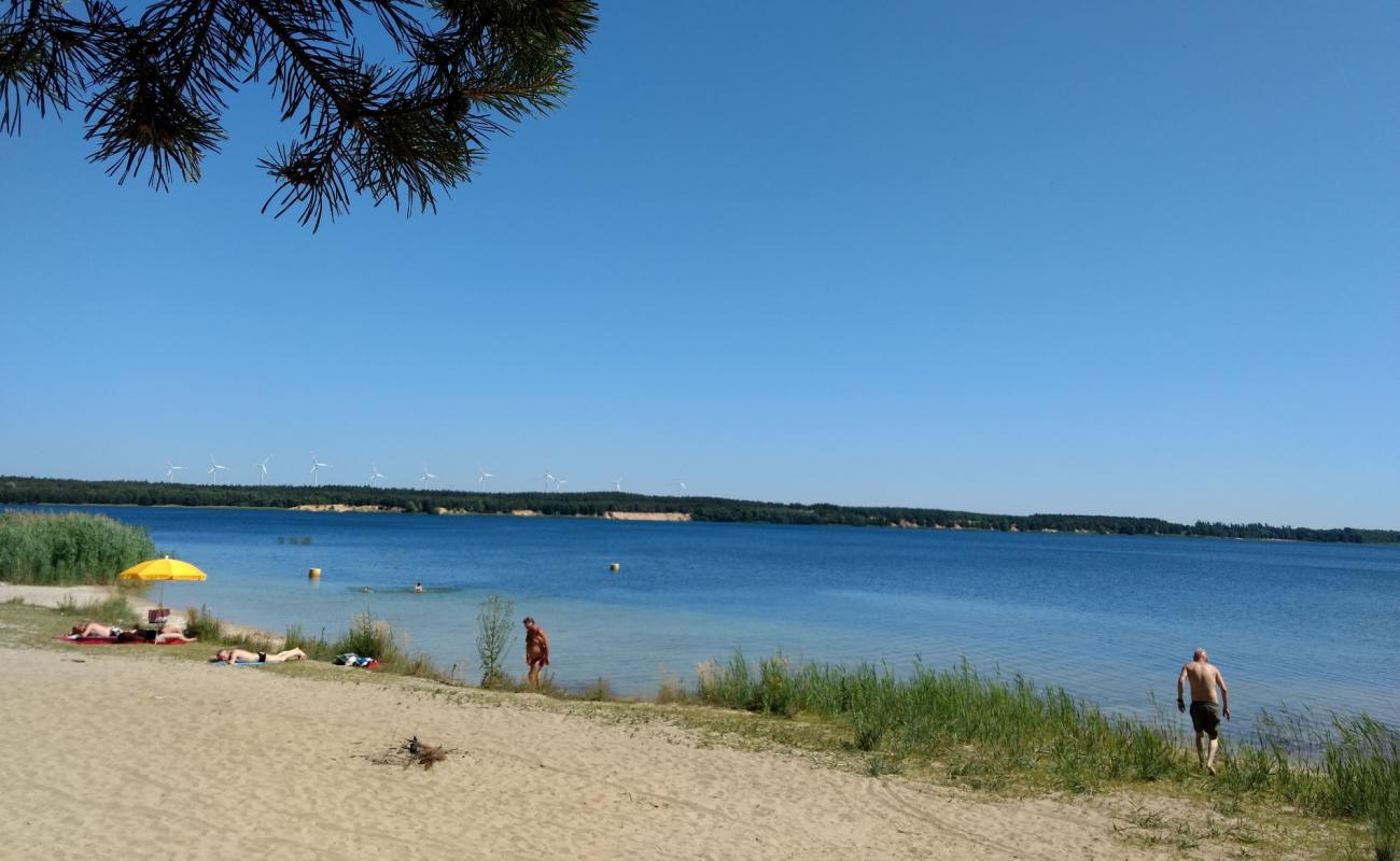 Фото Badestrand Scheibe-See с светлый песок поверхностью