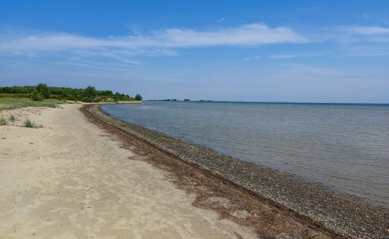 Фото Wampen Strand с светлый песок поверхностью