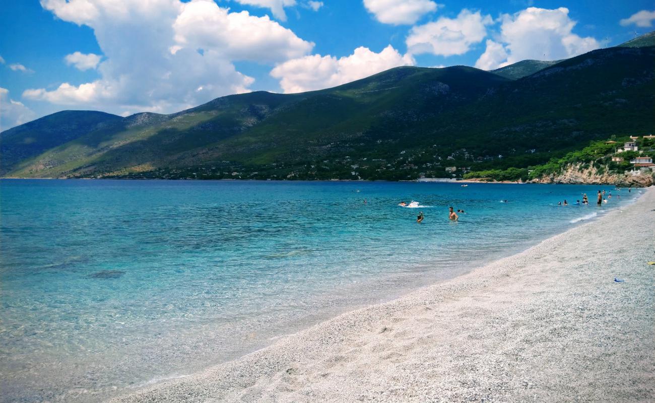 Фото Porto Germeno beach с белая чистая галька поверхностью