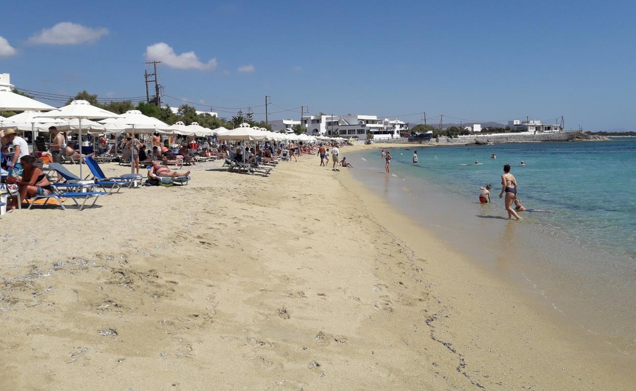 Фото Agios Georgios beach с золотистый песок поверхностью