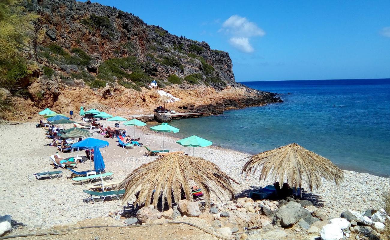 Фото Afrata Beach с светлая галька поверхностью