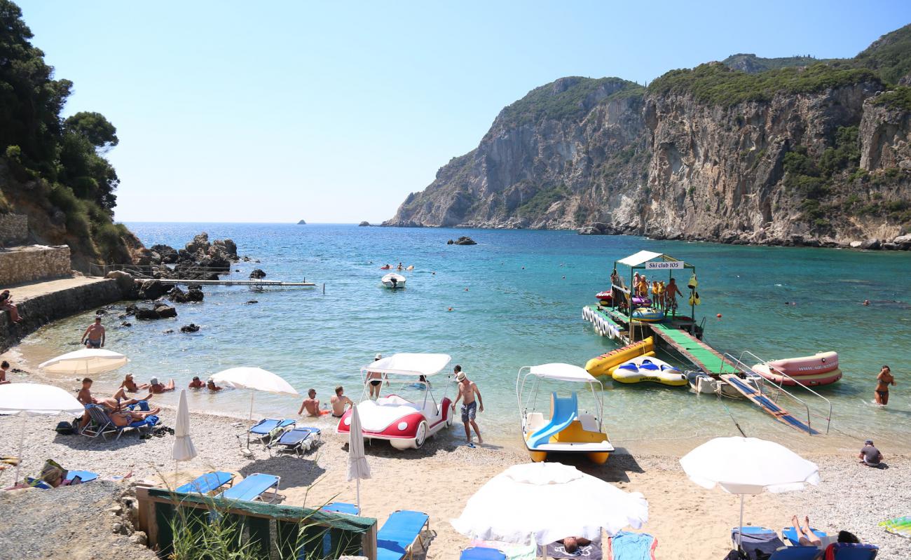 Фото Agios Petros beach с песок с галькой поверхностью