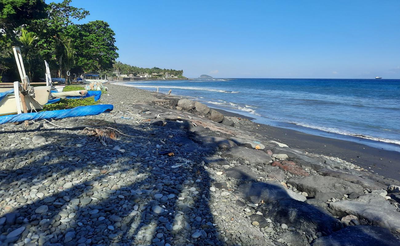 Фото Buitan Beach с серая галька поверхностью