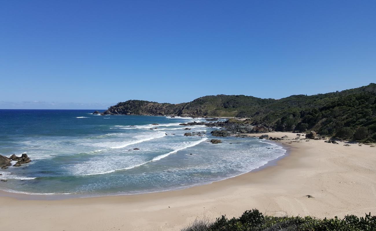 Фото Miners Beach с светлый песок поверхностью