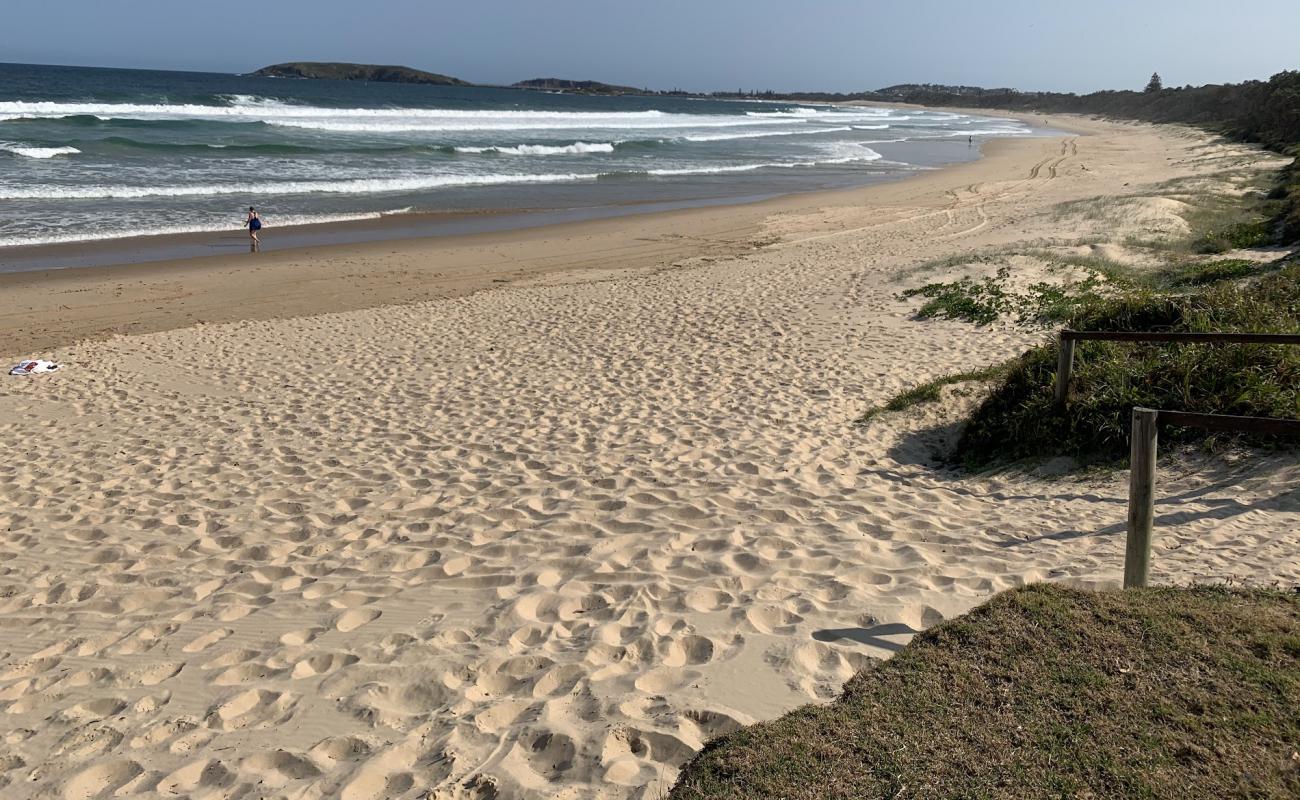 Фото Macauleys Headland Beach с золотистый песок поверхностью