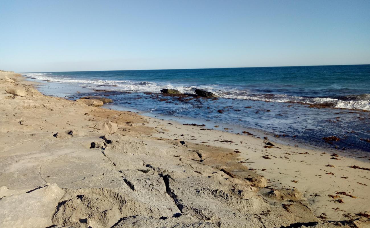 Фото African Reef Beach с песок с камнями поверхностью